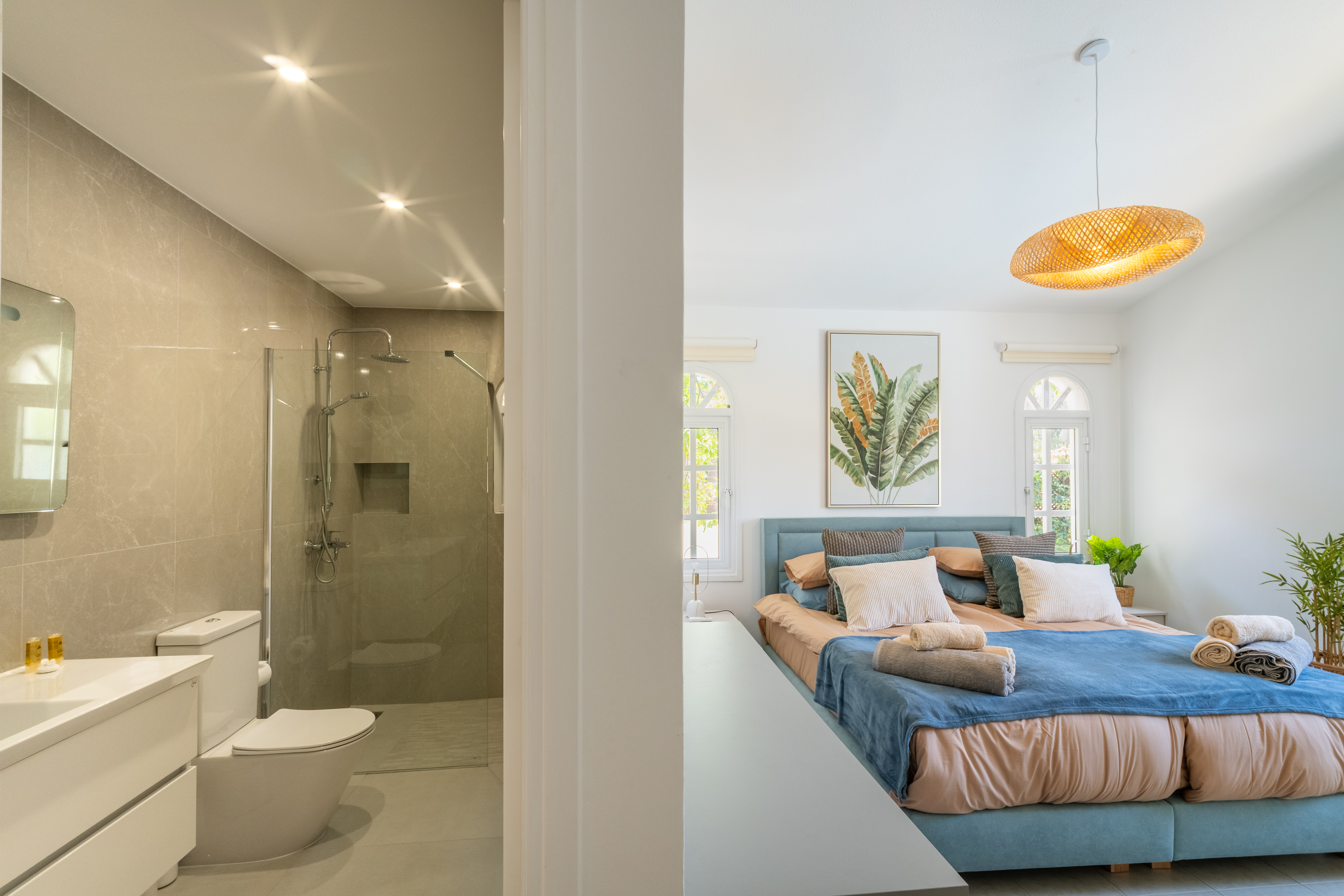 Sunny suite with spa shower, plush king bed, and calming decor