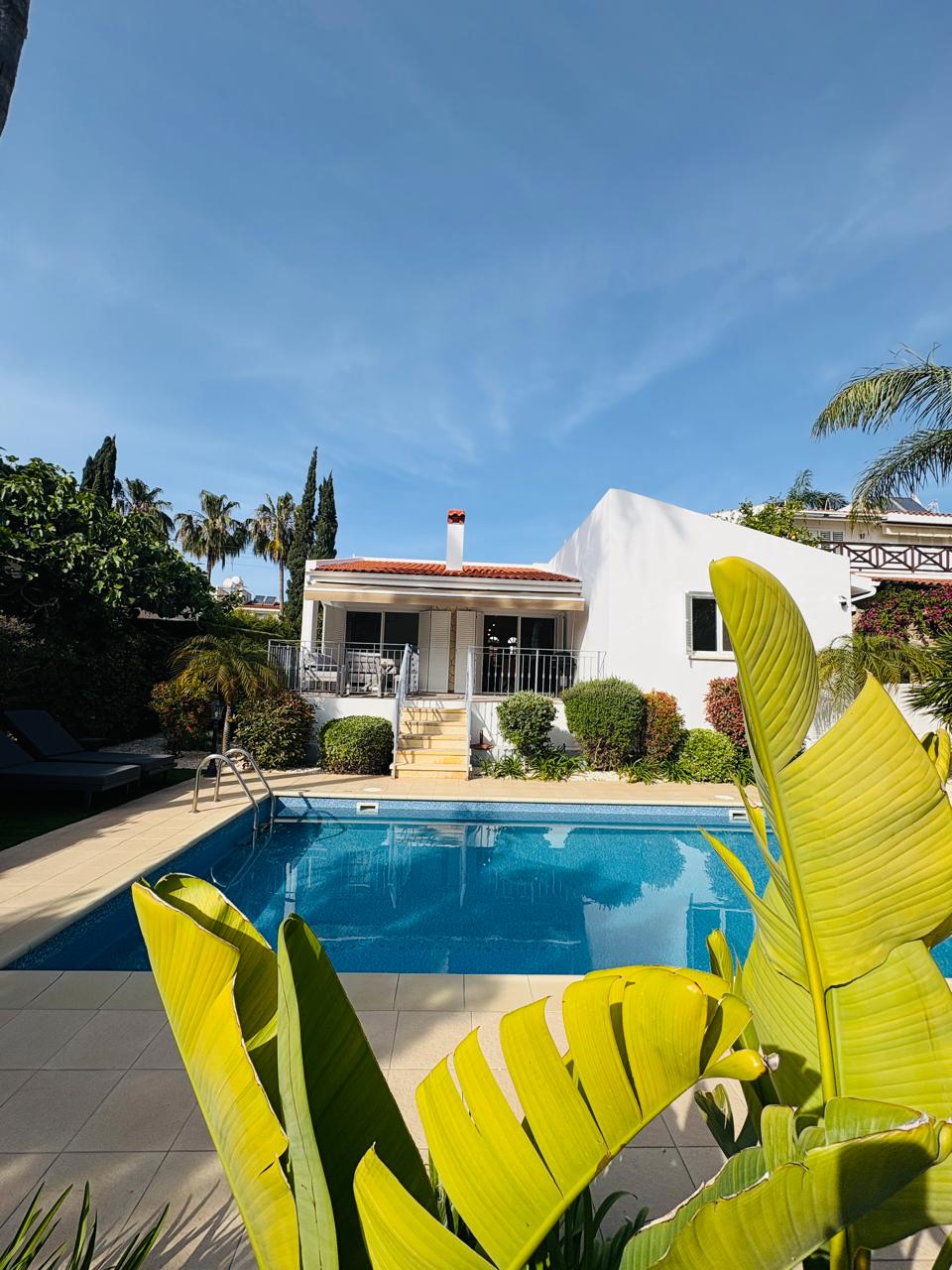 Mediterranean villa with private pool, shaded patio, lush gardens