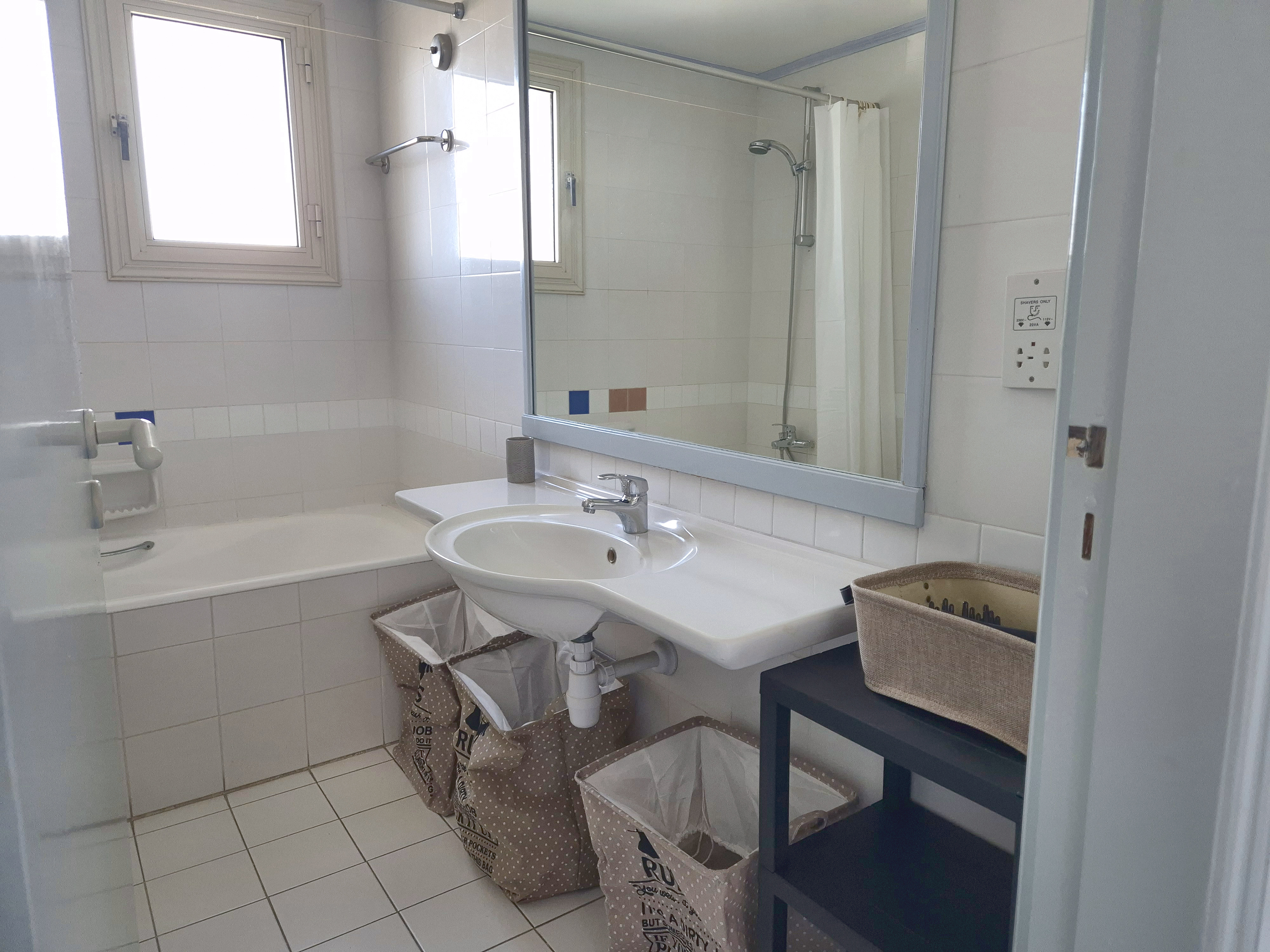 Bathroom with bath, shower and basin