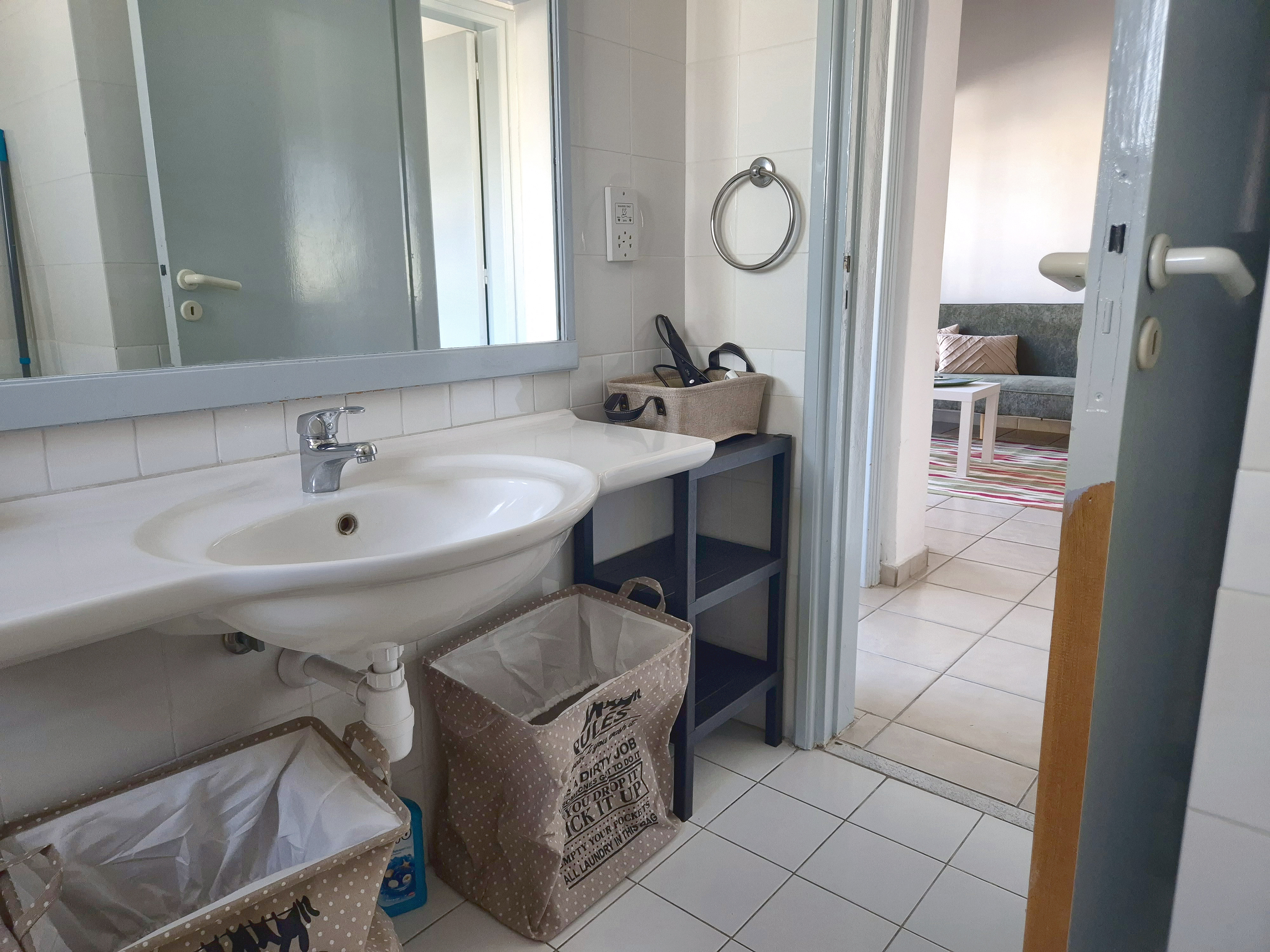 Bathroom basin, door to the living room