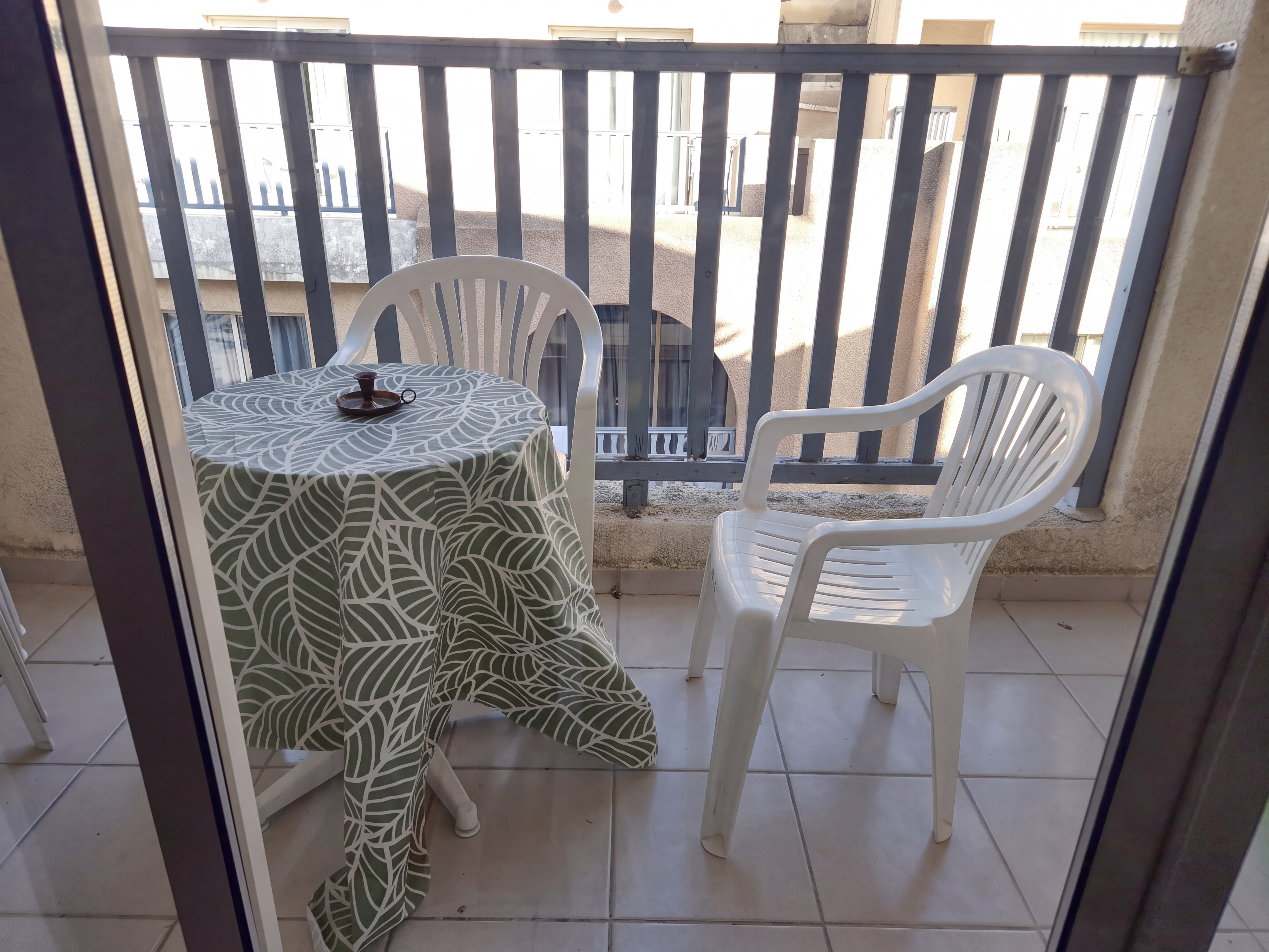 Balcony with table and two chairs