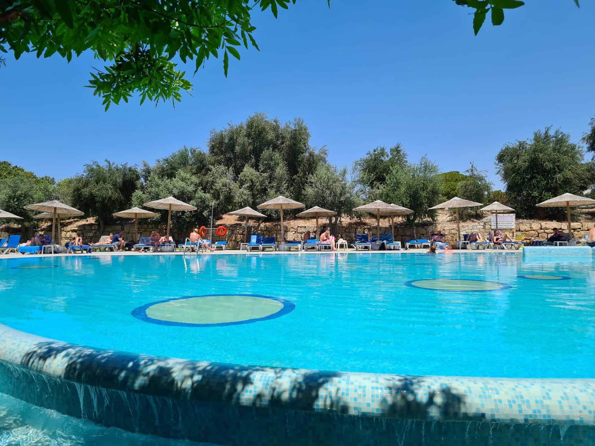 Resort pool with sunbeds and umbrellas