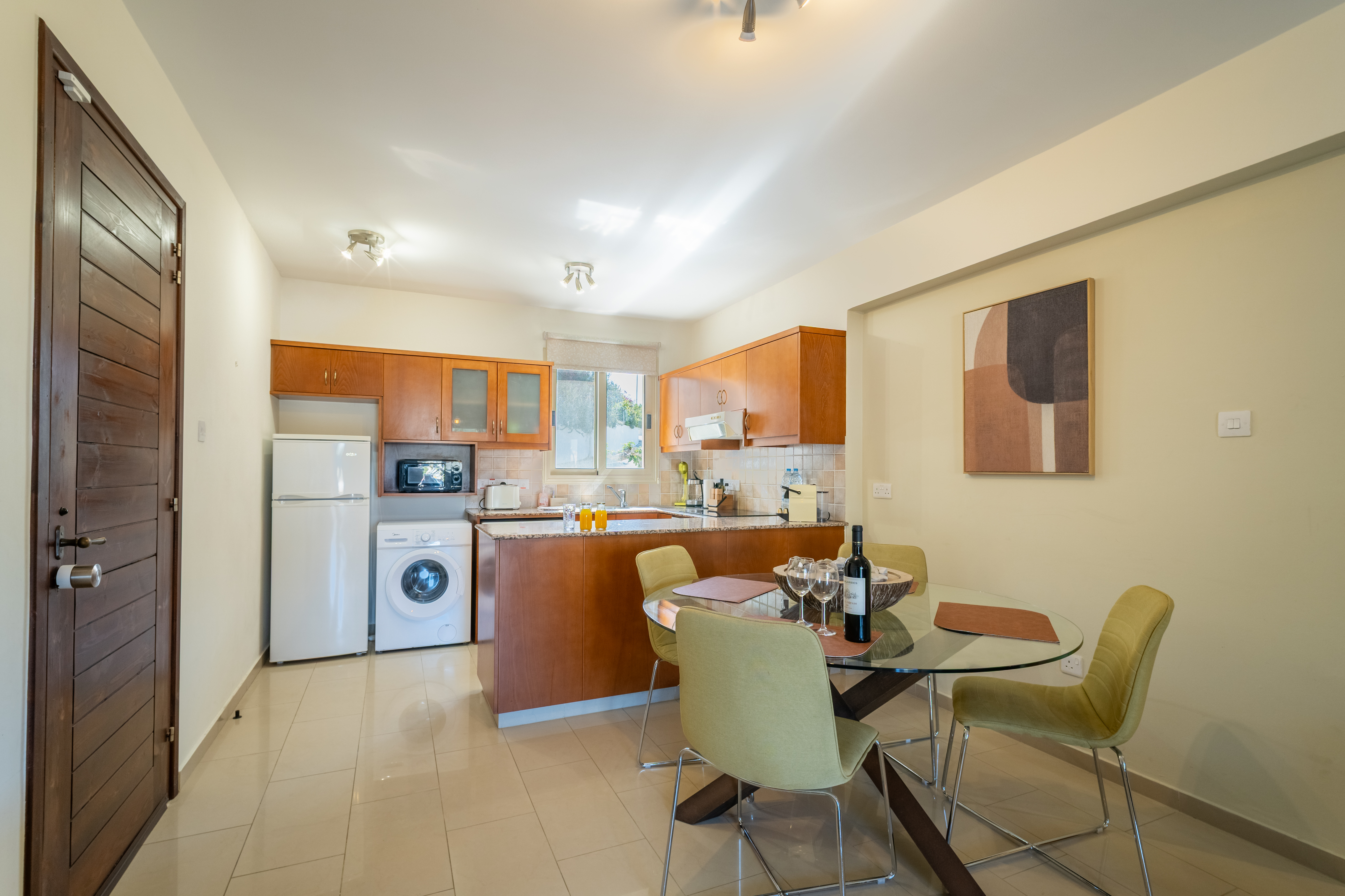 Sunny, fully equipped kitchen with dining for four & breakfast bar.